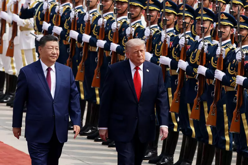 U.S. President Donald Trump reviews an honor guard with Chinese President Xi Jinping during a welcome ceremony at the Great Hall of the People on May 14, 2026 in Beijing, China.
