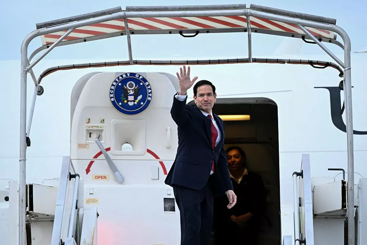 US Secretary of State Marco Rubio waves as he boards a US government aircraft following a G7 Foreign Ministers' meeting with Partner Countries at the Bourget airport in Le Bourget, outside Paris, on March 27, 2026.