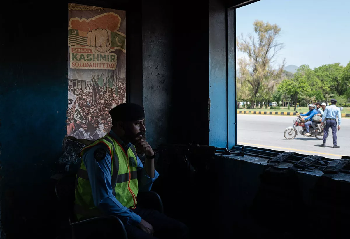 A member of Pakistani security personnel looks over a checkpoint from a police booth amid heightened security ahead of a potential meeting between U.S. and Iranian officials on April 20, 2026 in Islamabad, Pakistan.
