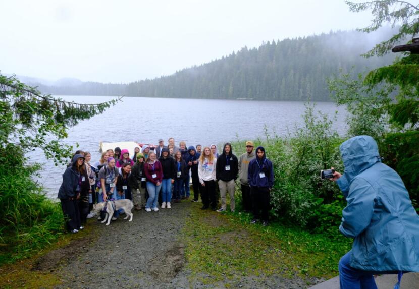 New students at the University of Alaska Southeast pose for a photo by Auke Lake during a campus tour as part of orientation in Juneau on Aug. 21, 2026.