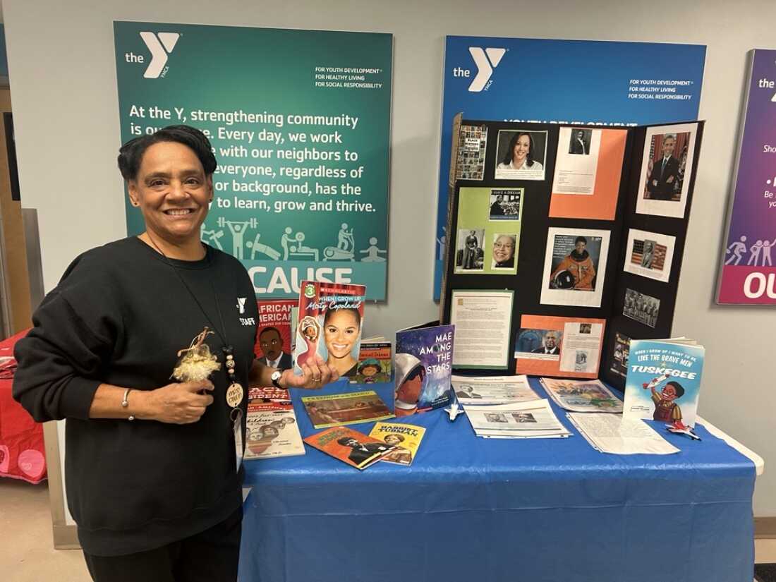 Gwen Partridge, known to her students as “Mrs. Gwen,” stands in front of an exhibit she created for Black History Month on Feb. 13. She’s uncertain others will be able to continue teaching Black history once she retires given the Trump administration’s orders that schools eliminate diversity initiatives or risk losing federal funding.