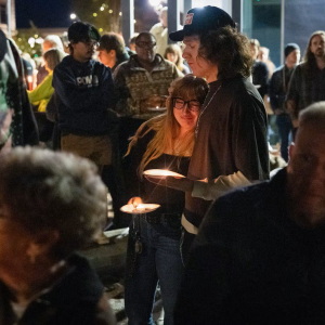 Braxxton Dahm comforts his wife Mickie Dahm during a vigil on Oct. 16, 2026, in downtown Bend, Ore.