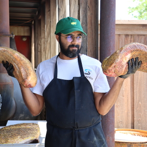 Zain Shafi prepares to put briskets in the smoker at Goldee’s BBQ in Fort Worth, Texas.