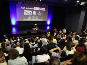 A Palestinian audience gathers in Bethlehem to see comedians from the U.S. and other countries perform live on Zoom after Israel refused to let the comics enter the country to participate in the Palestine Comedy Festival in the West Bank in August.