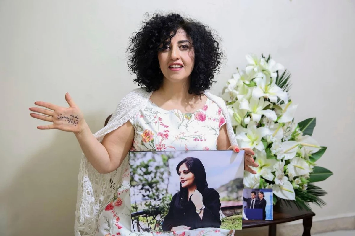 FILE - In this photo released by the Narges Foundation Archive, Nobel Peace Prize laureate Narges Mohammad is seen after being released on a medical furlough in Tehran, Iran, Wednesday, Dec. 4, 2024. On her hand written in Farsi is 'End gender apartheid.'