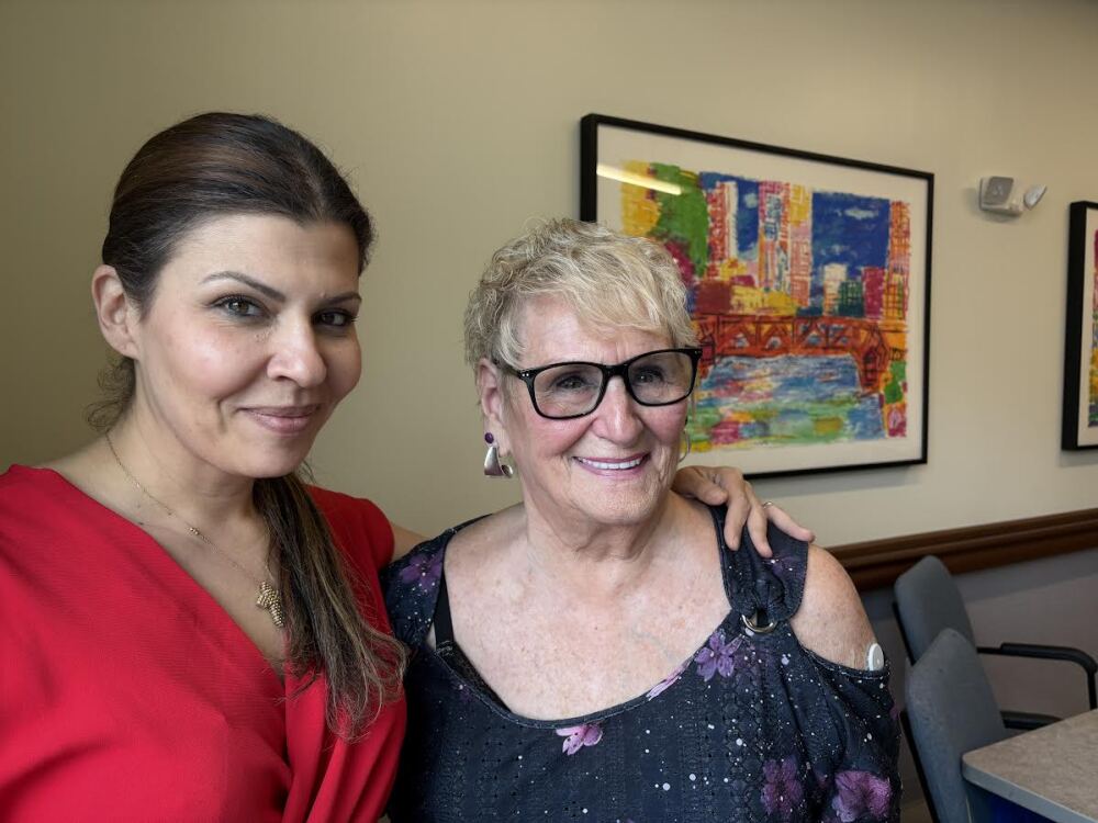 Roberta Rabinovitz, right, had cancer and had been living with her grandson, sleeping on his couch. With her is Rachel Nassif, day center director at the PACE Organization of Rhode Island in East Providence.