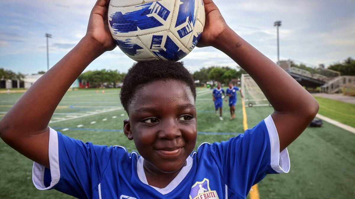 Little Haiti F.C. player Nozel Jean Kenson retrieves a ball during practice in December 2024 at the Little Haiti Soccer Park in Miami.