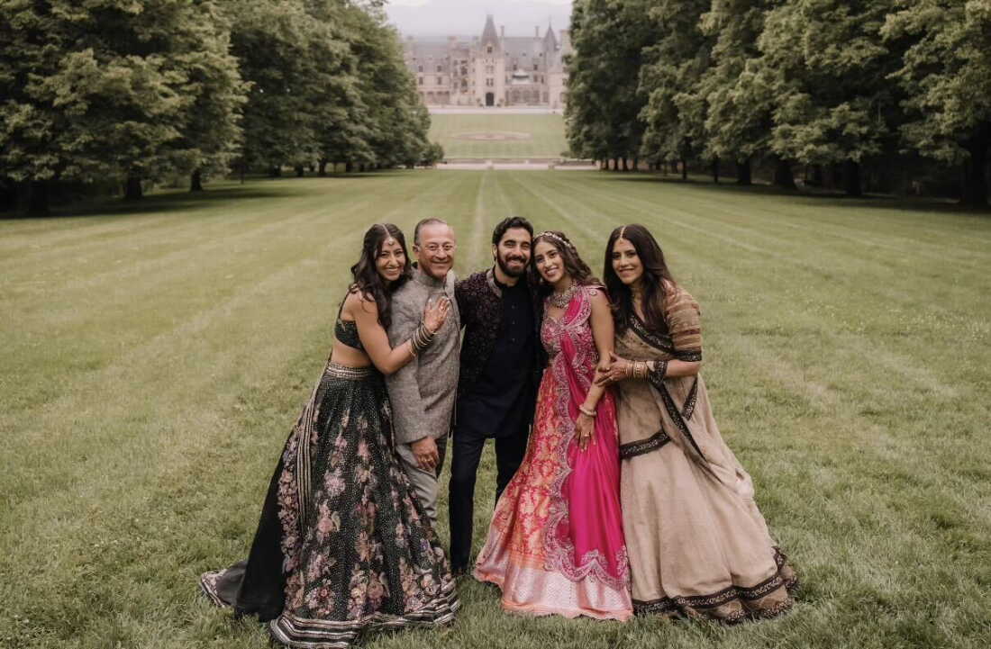 From left, Ashna Ahuja, Deepak Ahuja, Akash Mahtani, Shreya Ahuja and Madhu Ahuja attended Mahtani and Shreya Ahuja’s wedding in Asheville, N.C., in 2025.