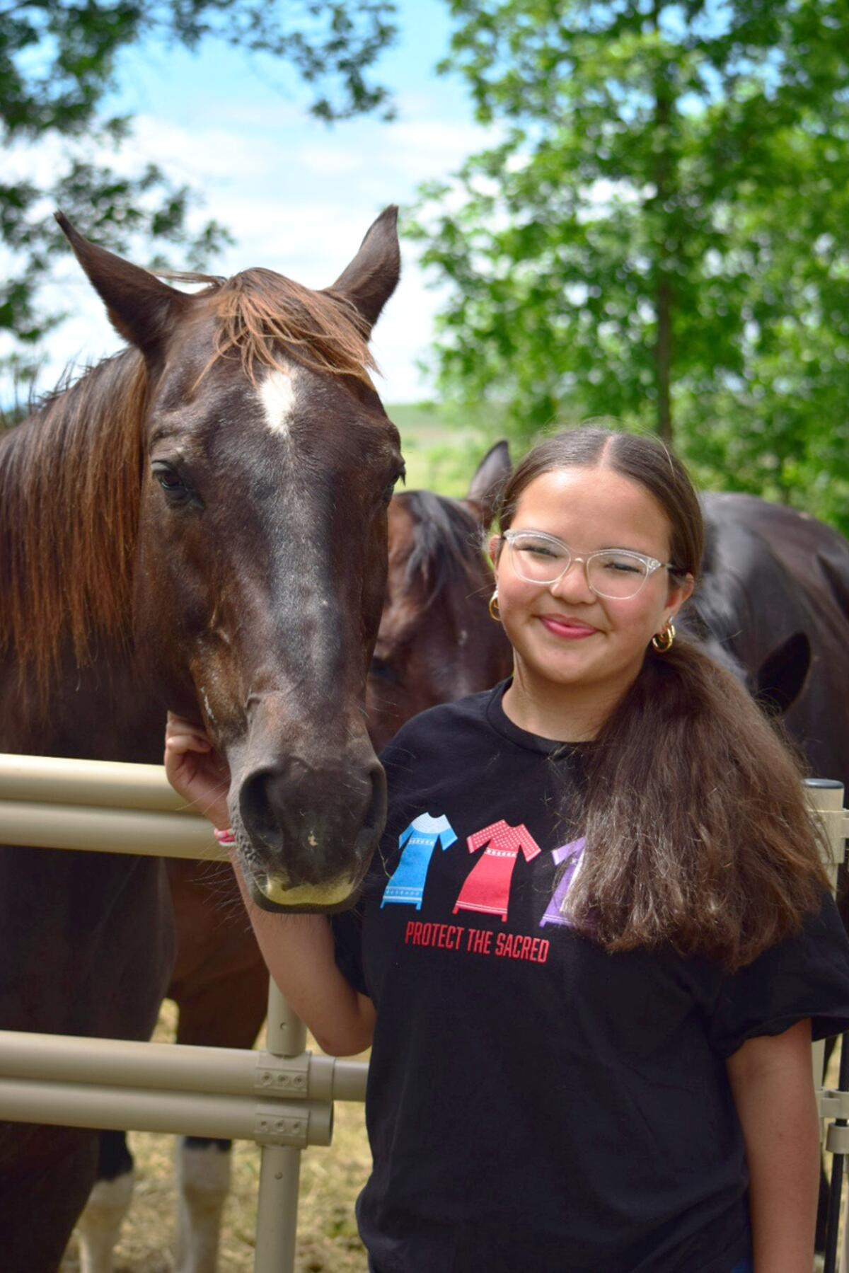 Gianna Larocque-Mahto rode her horse to the camp from nearby Busby, Mont., joining a group of other riders. They started their 'Victory Ride' in Ashland, Mont., roughly 60 miles away.