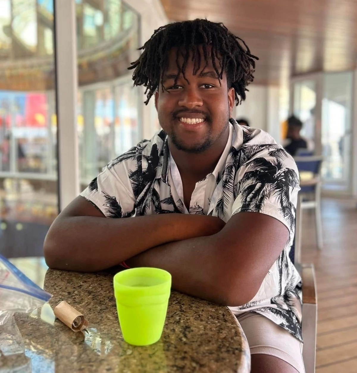 Calvin 'CJ' Dickey Jr. is seen on a cruise with his family in 2023. He died July 12, 2024, after his first football practice at Bucknell University.