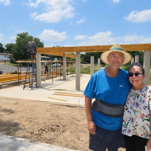 Scott and Juliet Welden in front of the construction of their new home in Kerrville.