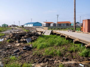 In August, damage from the October 2025 storm was still visible in Kipnuk.