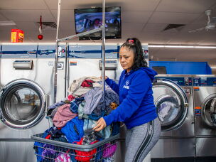 Nelly Villanueva washes her clothes in 2019.