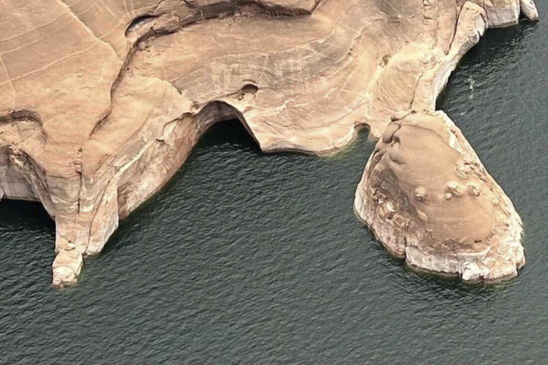 This photo provided by the National Park Service shows the Double Arch after it collapsed last week in the Glen Canyon National Recreation Area in southern Utah.