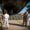 The Department of Homeland Security released photos of migrants as they boarded planes for Guantánamo Bay, Cuba.