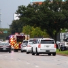 Law enforcement and emergency personnel respond near the scene of a shooting at a U.S. Immigration and Customs Enforcement detention facility in Dallas, Texas, on Wednesday. One person was killed and two were wounded in the shooting.