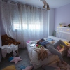 Lazy teenager laying in bed in her messy room