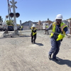 An AT&T crew installs a new cable at a railroad crossing in Hayward, Calif., after the segment got cut down by suspected copper wire thieves.