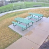 This photo provided by the City of Alton, Ill., shows security video of a sinkhole that opened in the middle of a soccer field on Wednesday in Alton, Ill. Authorities say a giant sinkhole that opened in the middle of the southern Illinois soccer field swallowed a large light pole and left a gaping chasm above an area where limestone is mined underground.