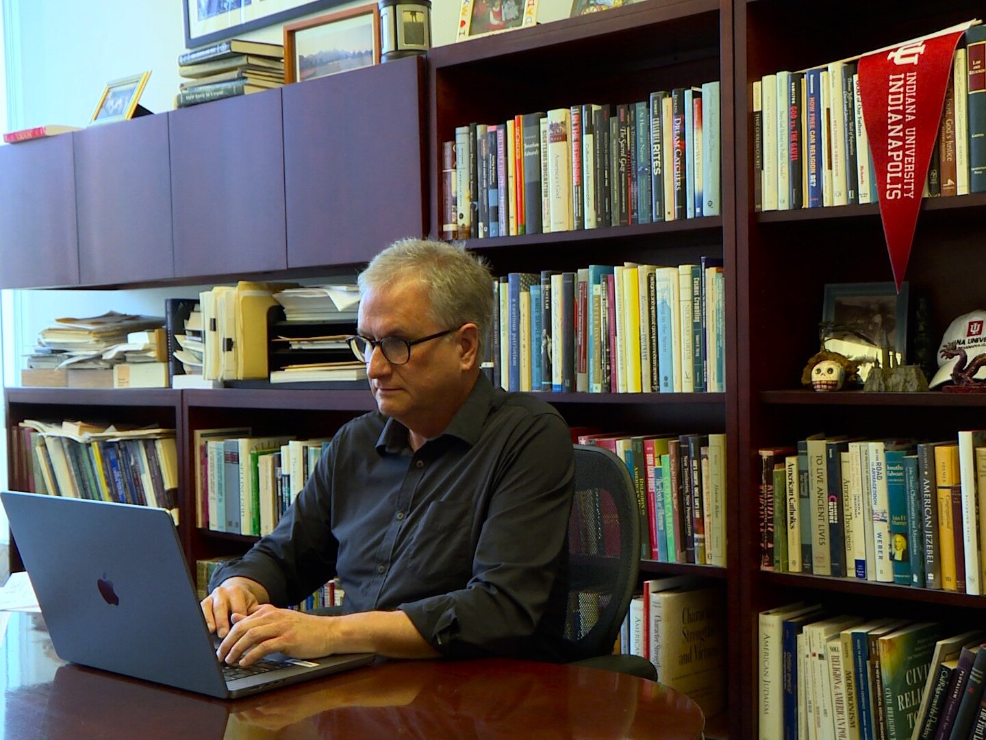 Indiana University Indianapolis Faculty Council President Philip Goff sits in his office.