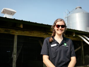 Katherine Jernigan of Transfarmation stands in front of an unused pig shed at 1100 Farm. Another shed nearby has been renovated and now houses the farm's mushroom-growing operation.