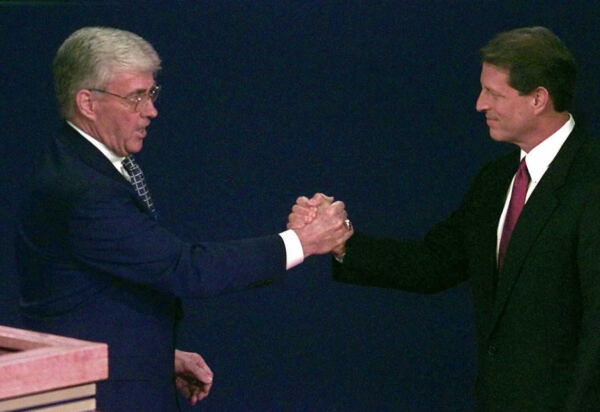Republican vice presidential candidate Jack Kemp (left) shakes hands with Vice President Al Gore moments before the 1996 vice presidential debate in St Petersburg, Fla. It was the last time -- until this year -- that both major parties had picked a veteran for vice president.