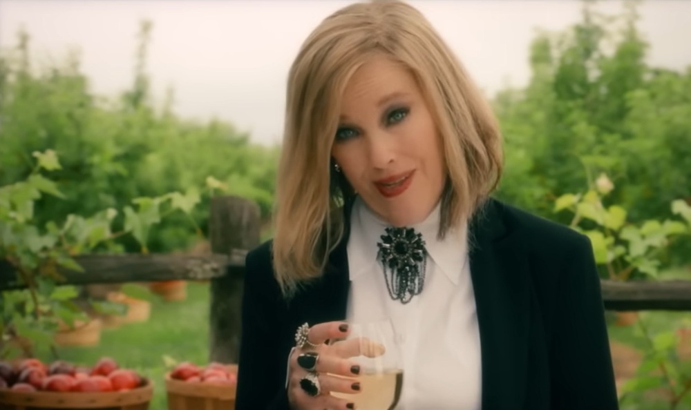 Moira Rose (Catherine O'Hara) appears in a commercial for Herb Ertlinger's fruit wine in an episode of <em>Schitt's Creek</em>. (Screenshot by NPR)