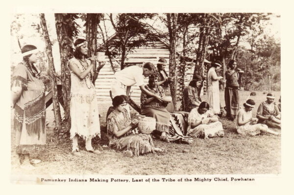 Pamunkey women making pottery at the Pottery School on the Reservation in the early 20th century.
