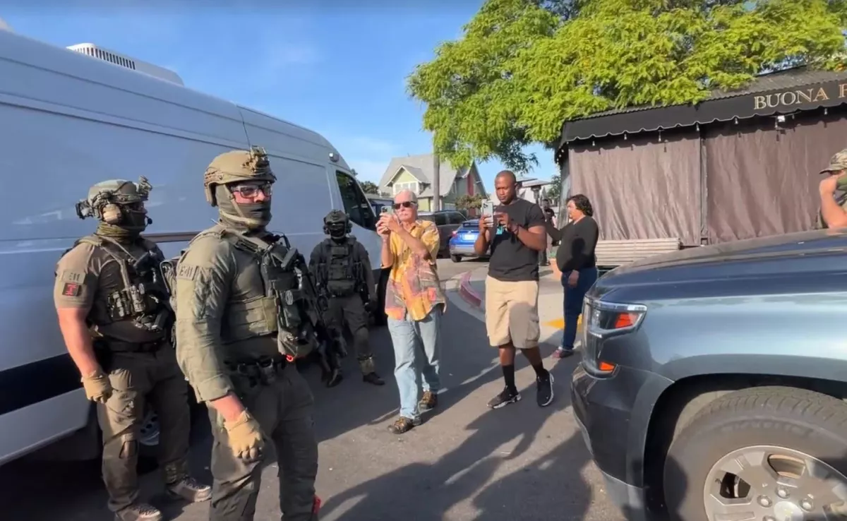 U.S. Immigration and Customs Enforcement agents execute a criminal search warrant on May 30, 2025, at Buona Forchetta in San Diego, Calif.
