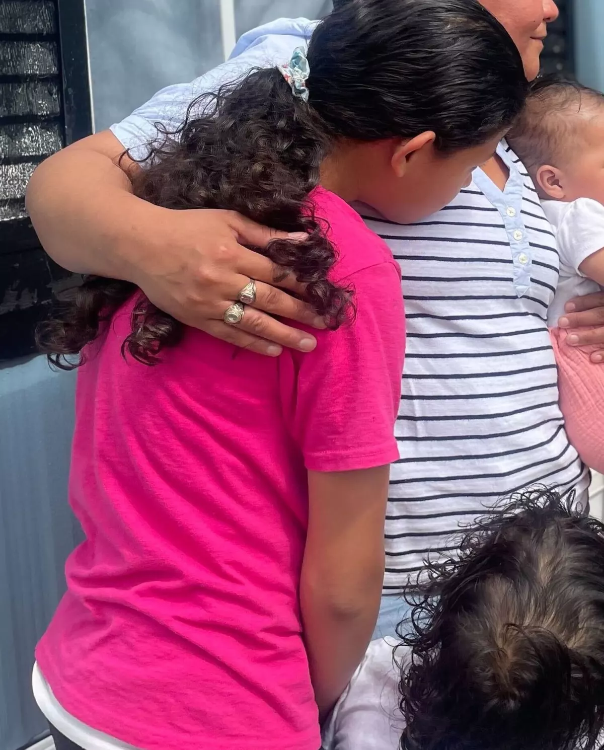 Mari hugs her children, all of whom are U.S. citizens. Mari has been adamant about staying in the U.S., while her husband says it's time for them to go back to Guatemala.