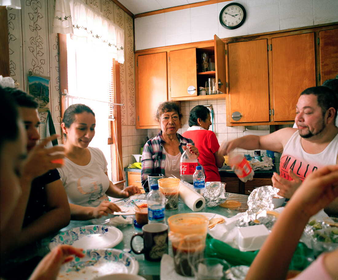 Jennifer Teresa Villanueva’s aunts, cousins, grandmother and uncle gather around the dining table for an afternoon brunch at home in Chicago in 2018.