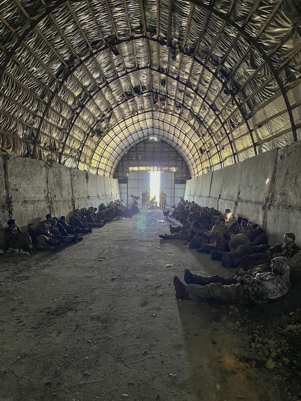 More than 100 Russian troops captured by Ukraine are held inside a shelter in Russia's western region of Kursk, on Aug. 14. The photo was provided by the Ukrainian Security Service via AP.