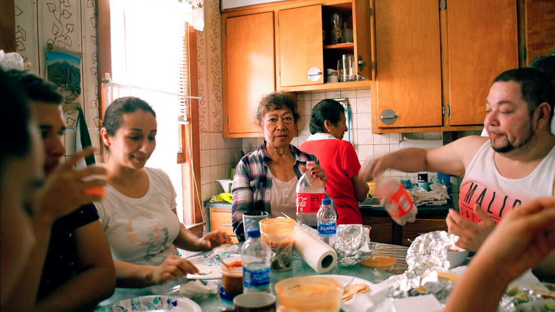 Jennifer Teresa Villanueva’s aunts, cousins, grandmother and uncle gather around the dining table for an afternoon brunch at home in Chicago in 2018.