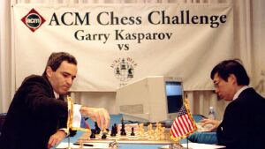 Garry Kasparov, left, takes a pawn in the opening minutes of a chess game against IBM's Deep Blue computer in Philadelphia on Feb. 10, 1996. Feng-hsiung Hsu, right, the principal designer of Deep Blue, keys a move into the computer.