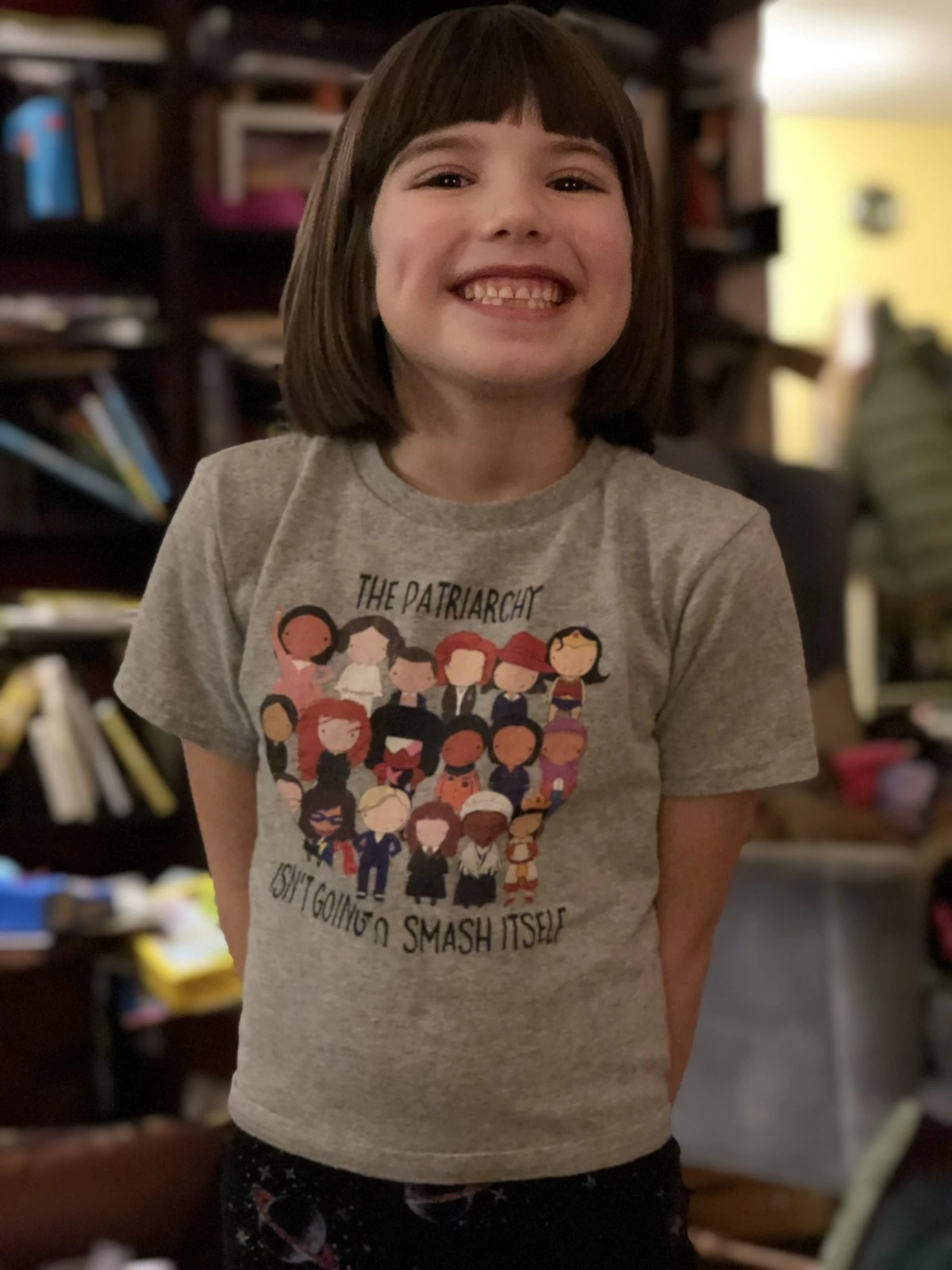 Bee, pictured when she was younger, wears a T-shirt covered in cartoon female heroes like Wonder Woman that she says now feels outdated. “I don’t think it has to be just brave women who are actively doing something for the country,” she says. “It can be anyone.”