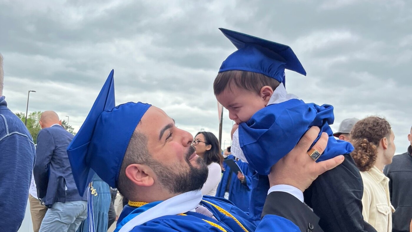 Why did university police chase a student and his baby across a graduation stage?