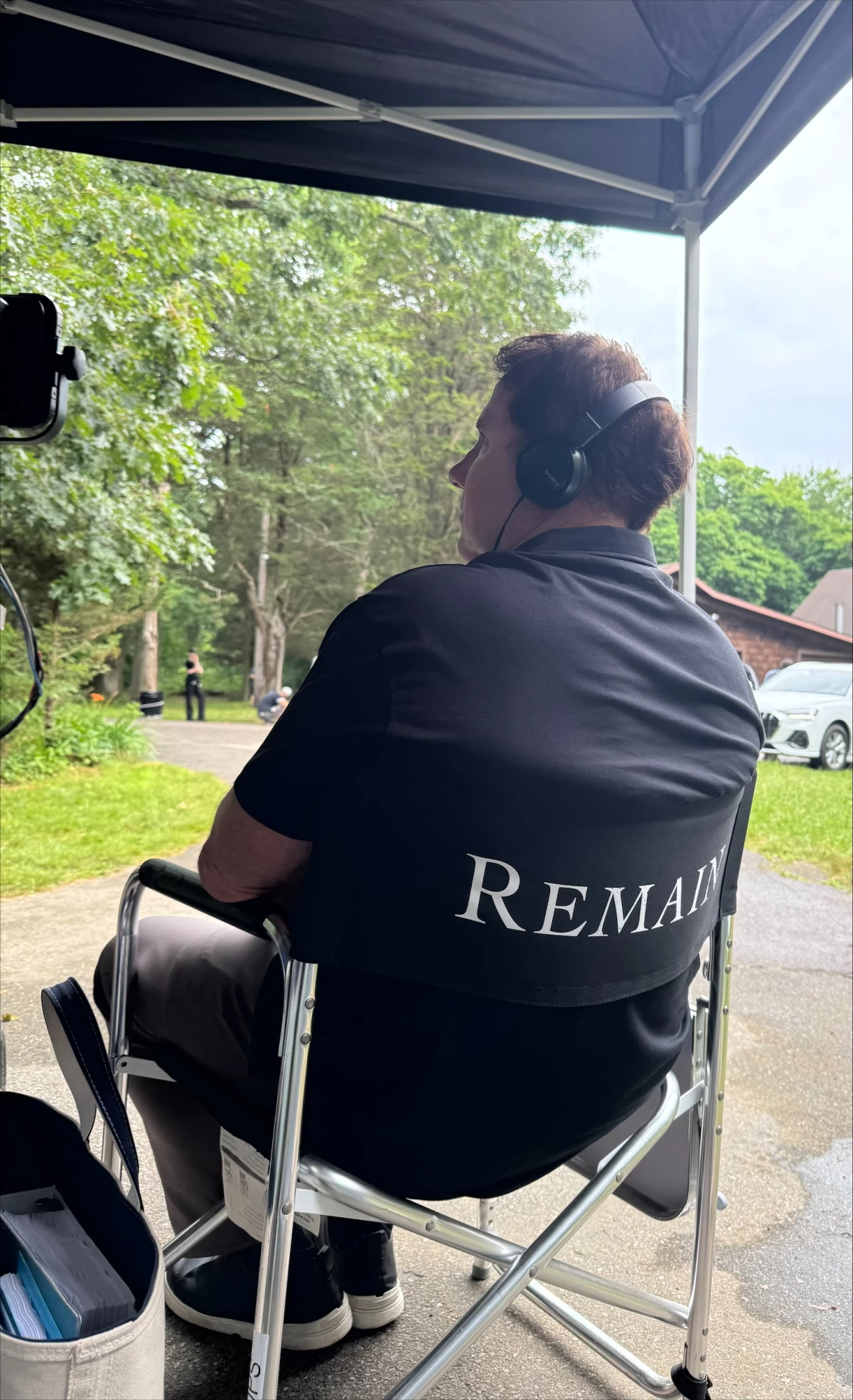 Nicholas Sparks is shown watching the set of Remain, a film and novel project he developed with M. Night Shyamalan.