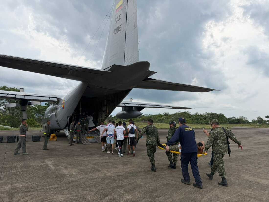 In this photo distributed by Colombia's Armed Forces press office, people who were injured on a military cargo plane that crashed shortly after take off are loaded on to another military plane to evacuate them for treatment, from Puerto Leguizamo, Colombia, Monday, March 23, 2026.