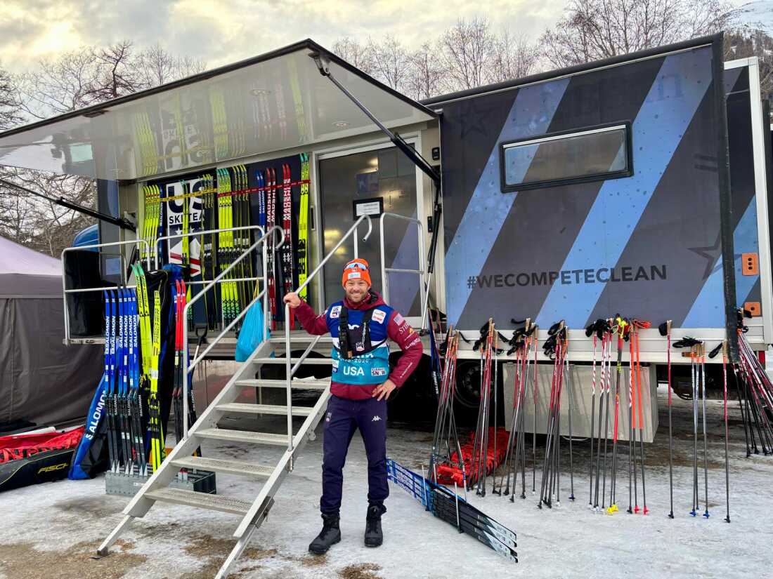 U.S. cross-country ski team coach Matt Whitcomb with Yolanda the wax truck and some of the 600 pairs of skis it holds at a World Cup race in Goms, Switzerland Jan. 23, 2026
