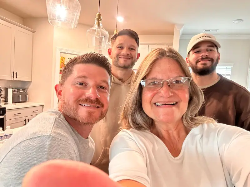Homero Calderón, second from left to right, poses with his family.