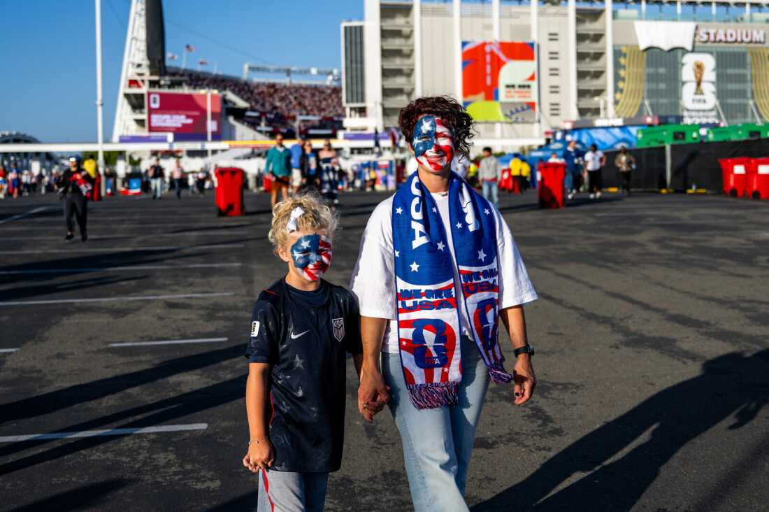Brenda Moss and daughter Rome, 8, stand in front of the San Francisco Bay Area Stadium.