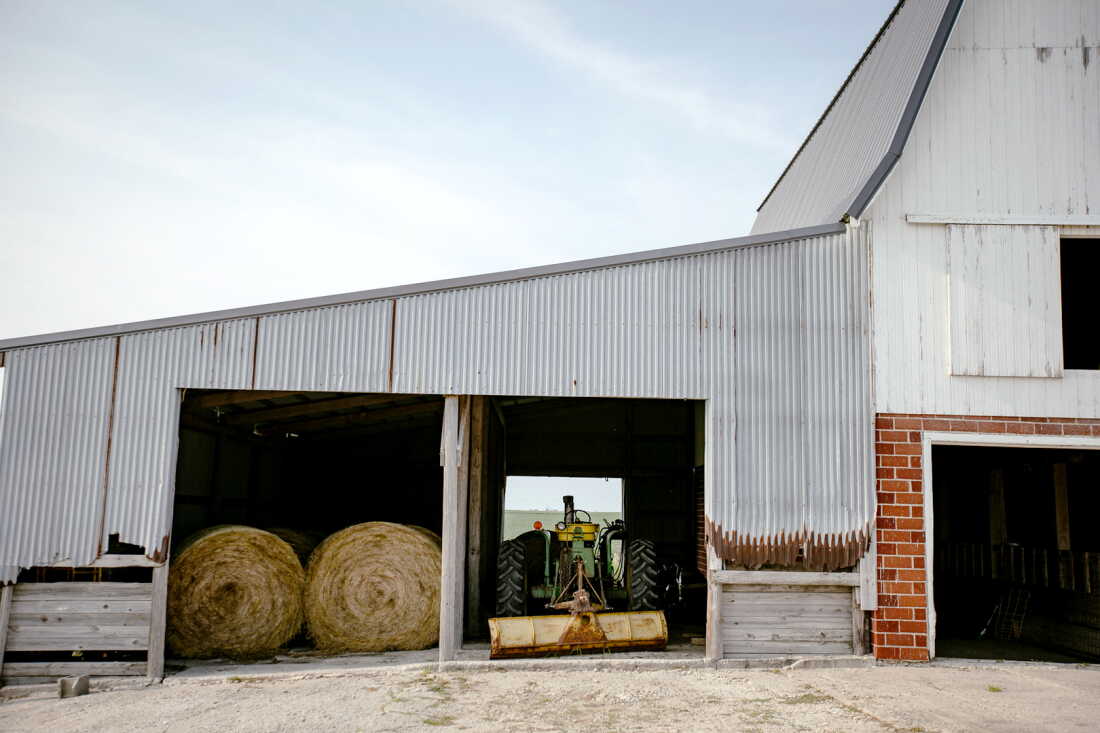 Hay bales and farm equipment at the Faaborg family farm in central Iowa.