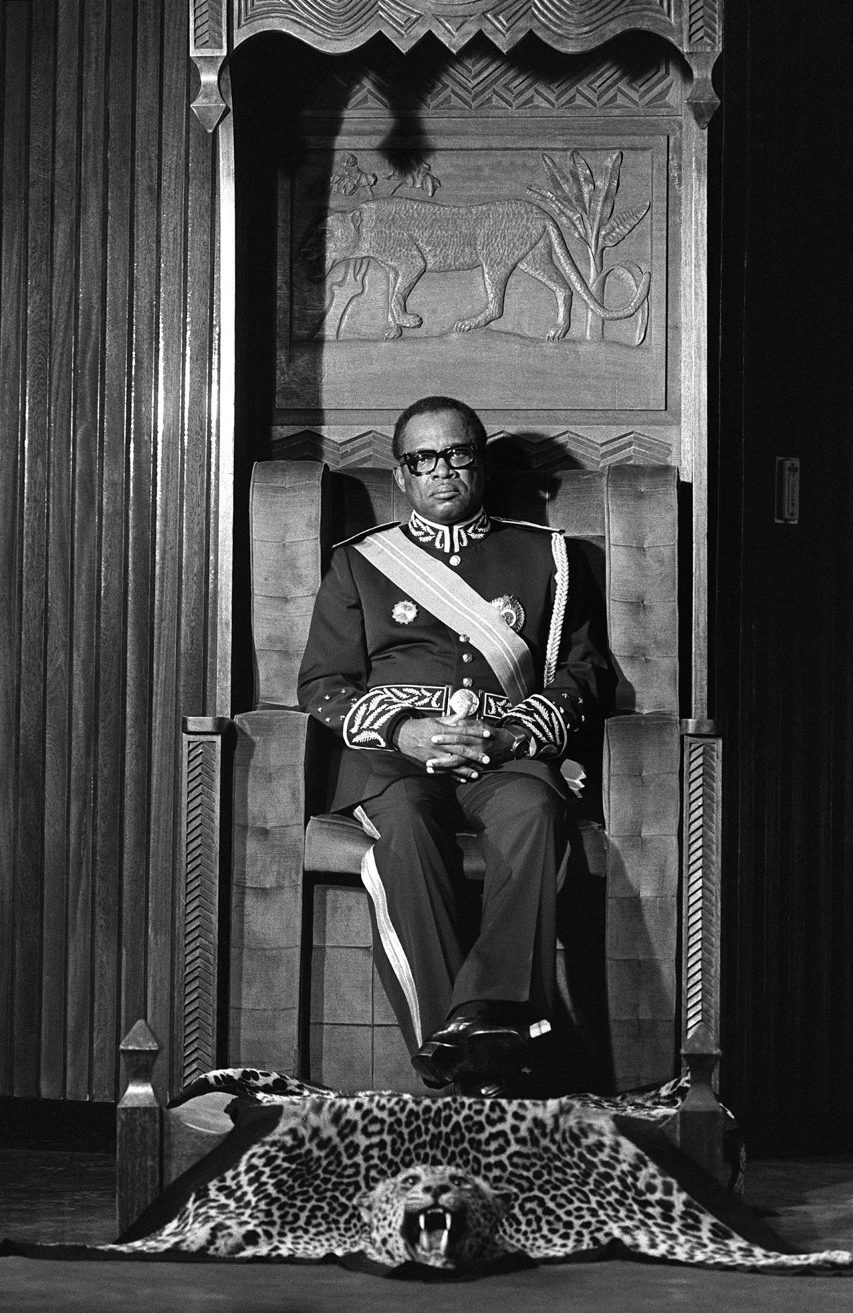 Mobutu Sese Seko, president of Zaire (now the Democratic Republic of the Congo), sitting on a throne with feet rested on a tiger skin,  takes oath on December 05, 1984 in Kinshasa.