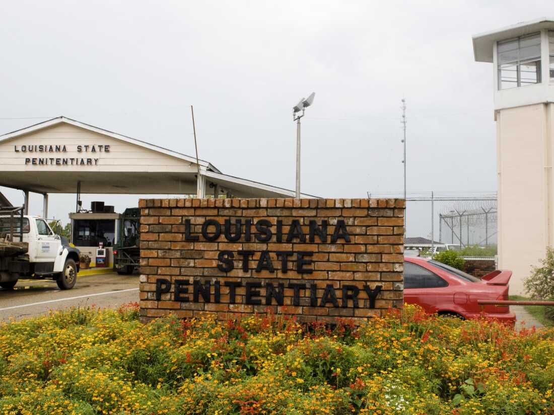 Vehicles enter at the main security gate at the Louisiana State Penitentiary — the Angola Prison, the largest high-security prison in the country in Angola, La., Aug. 5, 2008.