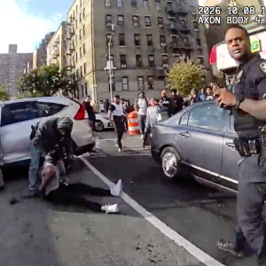 In this image taken from police-worn body camera video released the New York City Police Department (NYPD), law enforcement personnel tend to a Oscar Belgal, 28, a Dominican man who was shot by Federal immigration officers, Thursday, Oct. 8, 2026, in New York, as he drove his car with a 5-year-old boy inside. 