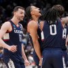 UConn guard Braylon Mullins, right, celebrates his game winning basket with guard Malachi Smith (0) during the second half in the Elite Eight of the NCAA college basketball tournament against Duke, Sunday, March 29, 2026, in Washington.