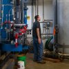 Chris Hughes, assistant water and wastewater operator for the towns of Cavendish and Proctorsville in Vermont, deals with the effects of a power outage at a drinking water facility.