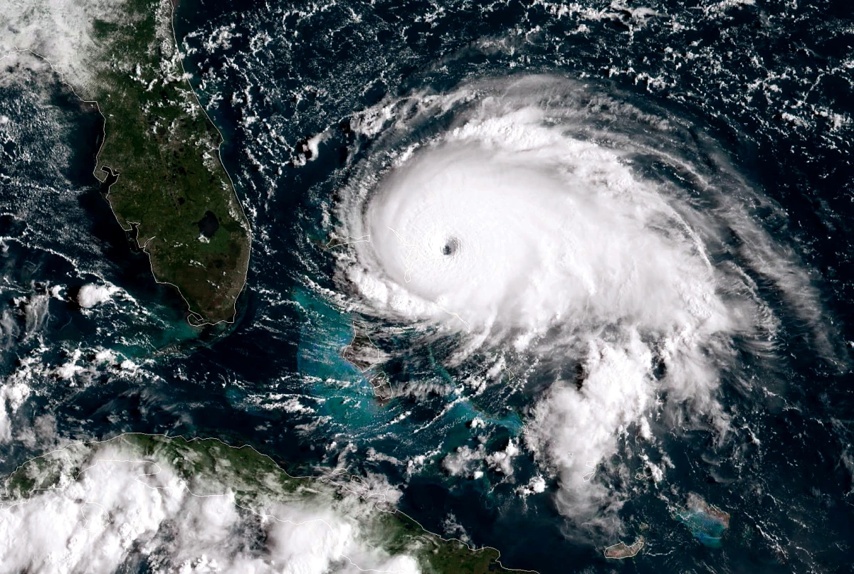 Images like this one of Hurricane Dorian taken in 2019 by a NOAA GOES-East satellite show the powerful category 5 storm as it stalled over the Bahamas. Meteorologists use satellites to prepare hurricane forecasts. But proposed funding cuts could eliminate the next-generation of this technology.