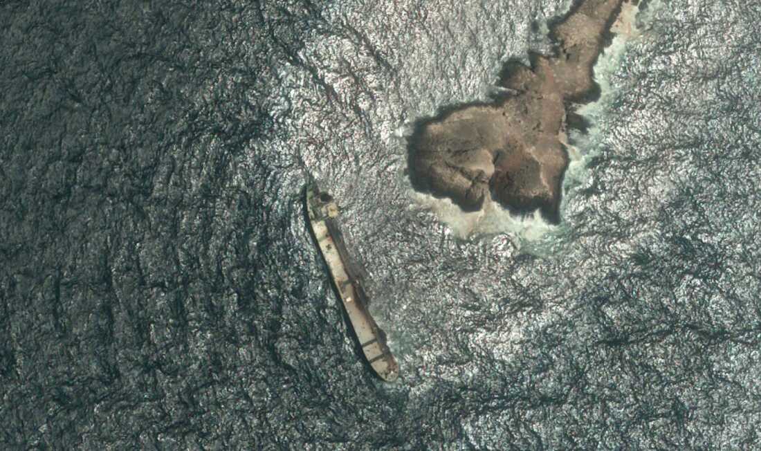 This satellite photo taken Wednesday Aug. 5, 2026, shows the tanker Caroline Bezengi, grounded and partly submerged off the coast of Oman, leaking crude oil into the sea.