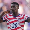 ABD'li Folarin Balogun (20), Çarşamba günü San Francisco yakınlarındaki Santa Clara, Kaliforniya'da ABD ile Bosna-Hersek arasında oynanan Dünya Kupası 32. tur maçında takımının ilk golünü attıktan sonra tepki gösterdi.